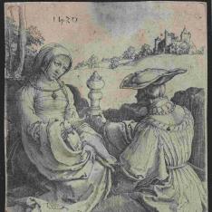 Un caballero y una dama sentados en el campo