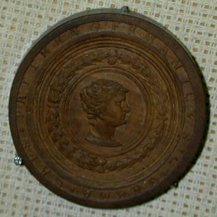 Ficha de Tric Trac con los retratos del emperador Germánico y su esposa Agripina