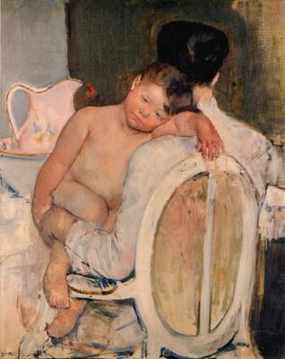 Mujer sentada con un niño en brazos