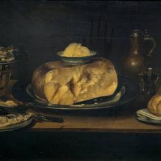 Bodegón: mesa con vajilla, queso, salchichón, pescados...